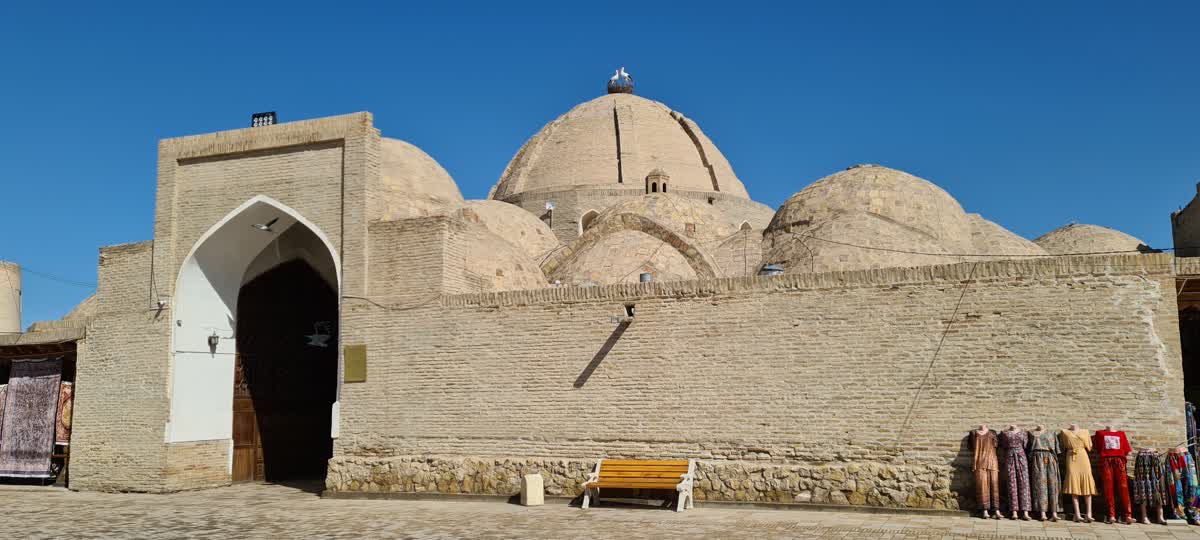 Interior of the Toqi Zargaron dome in Bukhara, showing the brick cupola ceiling above the market