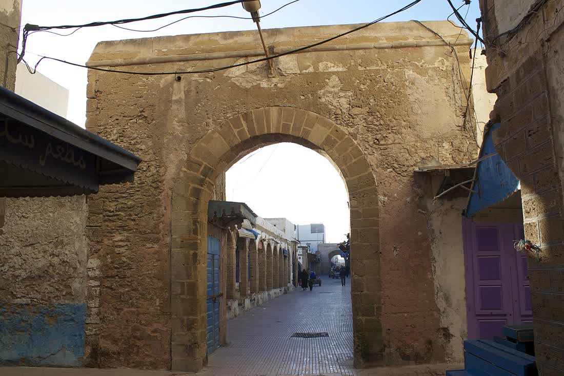A street in the medina of Essaouira, whitewashed walls and blue-painted woodwork