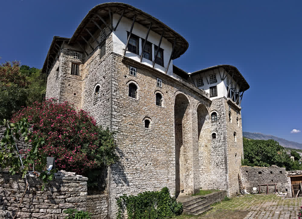 The Zekate House, a fortified Ottoman-era tower house in Gjirokastër with twin towers and projecting wooden upper storeys