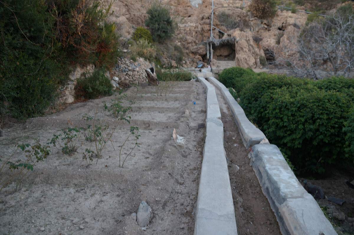 A falaj irrigation channel running through the terraces of Al Ayn on Jebel Akhdar
